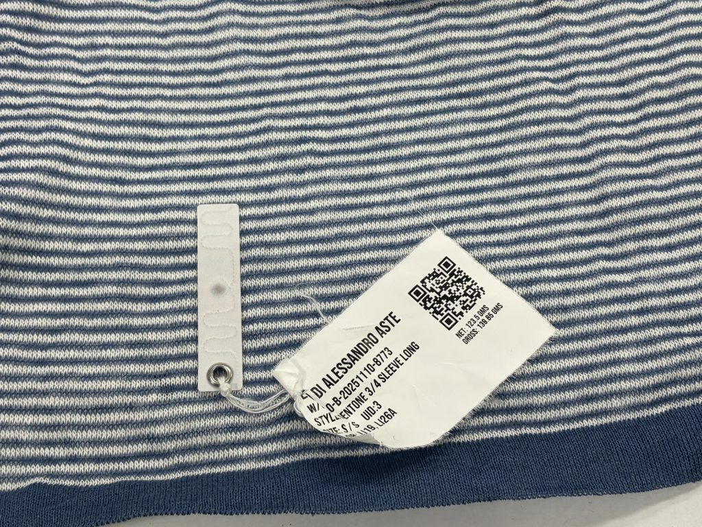 Printed QR code and washable RFID tag on a knitted panel